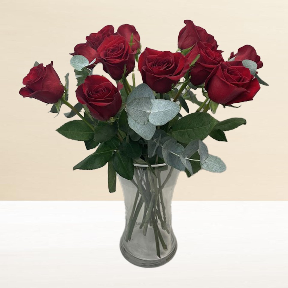 A vase of red roses.