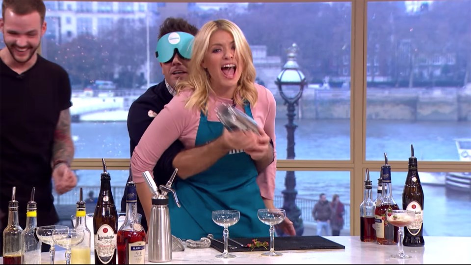 Gino D'Acampo and Holly Willoughby on This Morning making cocktails in a blindfolded competition.