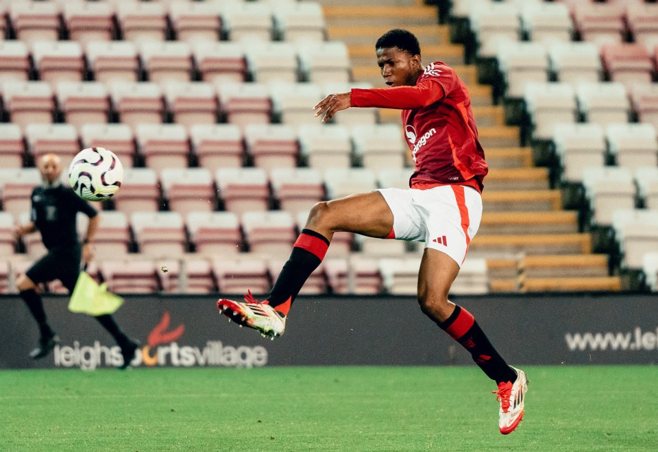 Manchester United's Chido Obi-Martin scoring a goal.