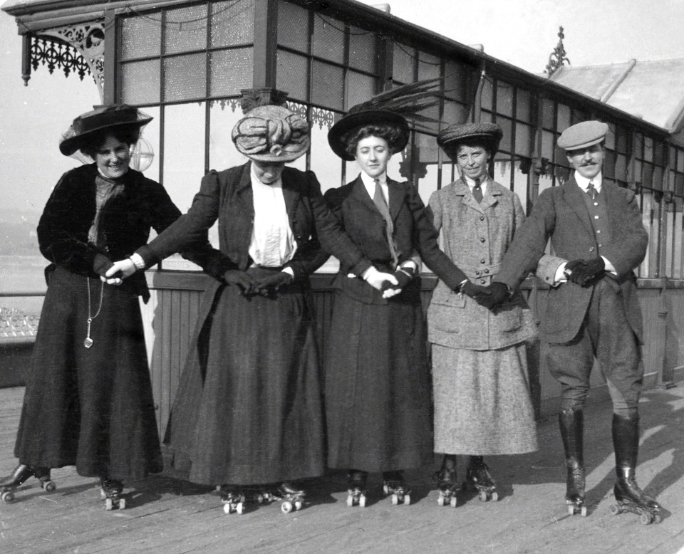 Five people on roller skates.