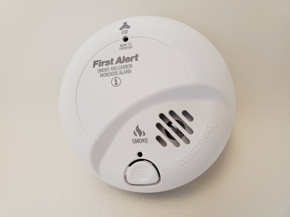 Close-up of a First Alert smoke and carbon monoxide alarm.