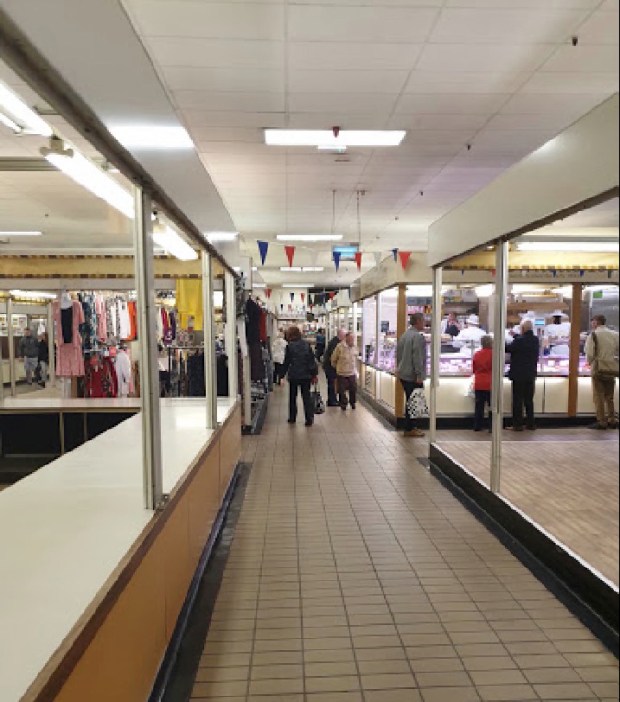 Interior view of a market nearing closing time.