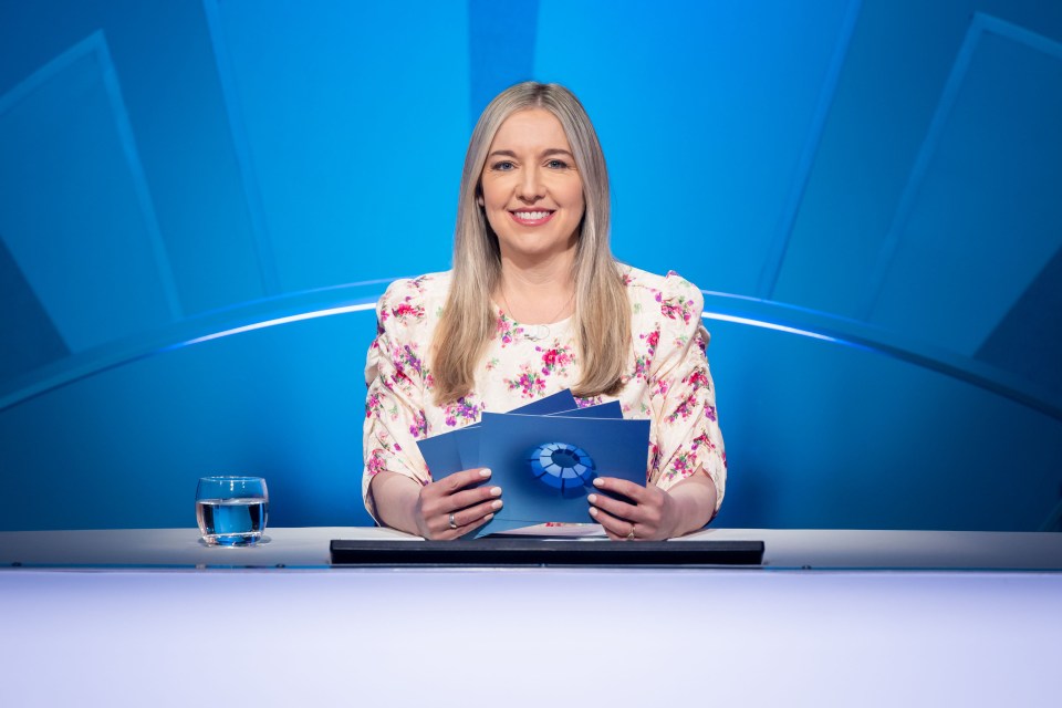 Victoria Coren Mitchell on the set of Only Connect, holding game cards.