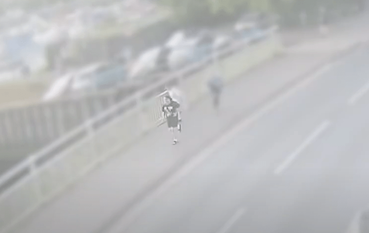 Person running on a road.