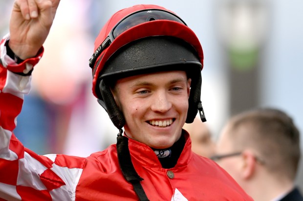 Jockey Michael O'Sullivan celebrates a win at the Cheltenham Festival.