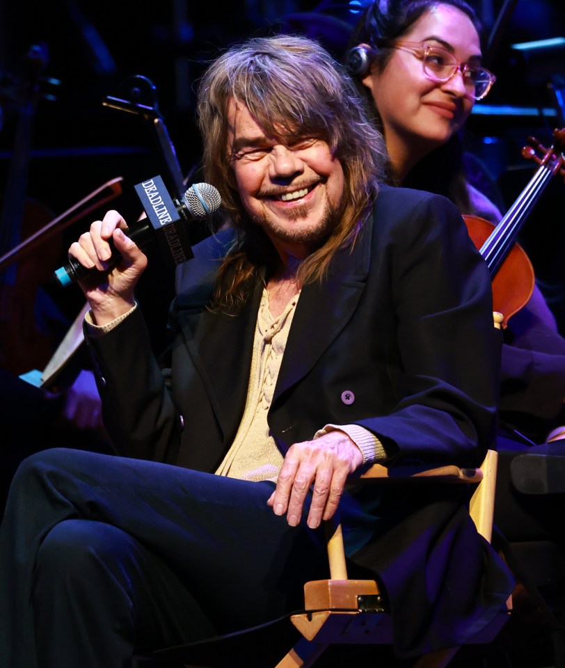 David Johansen speaking at a microphone.