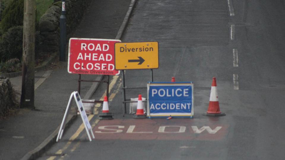 Road closed due to police accident.