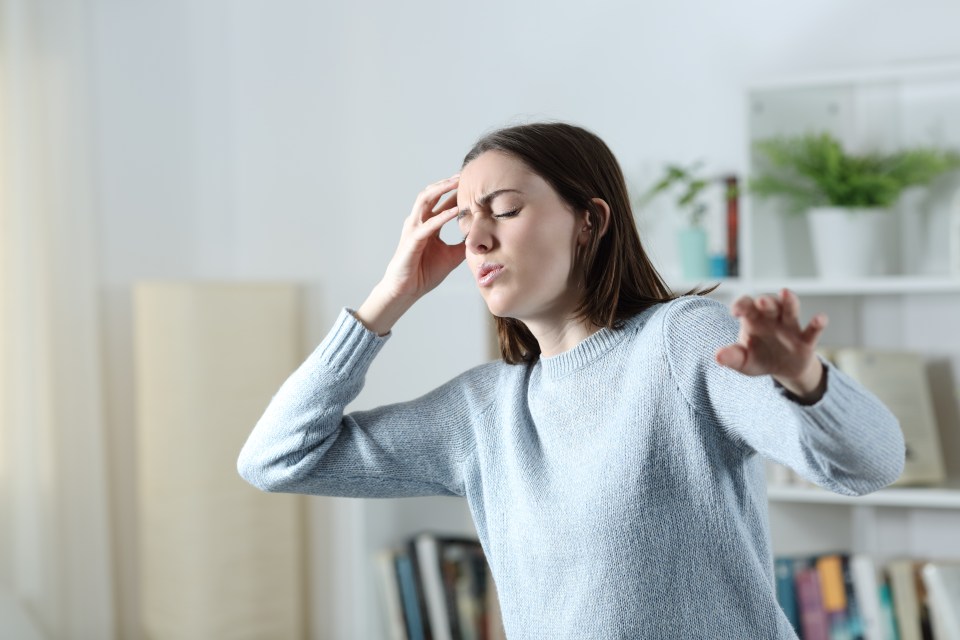 Woman experiencing a vertigo attack.