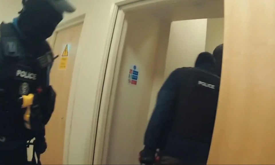 UK police officers in raid.