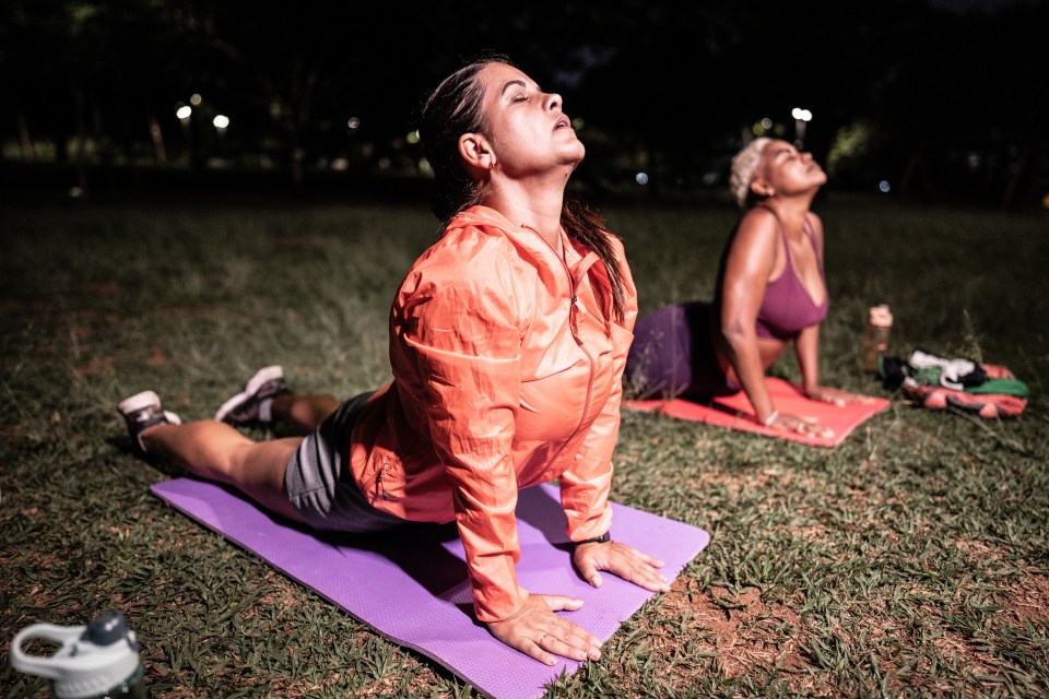 Mature woman practicing yoga at the public park