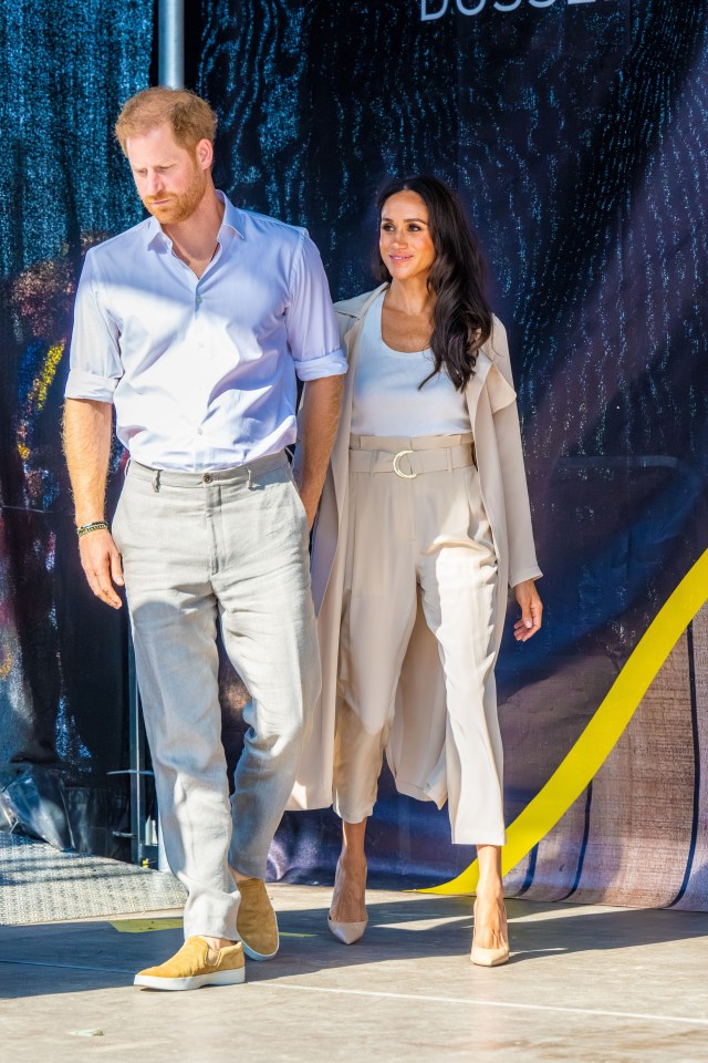 Prince Harry and Meghan Markle walking together.