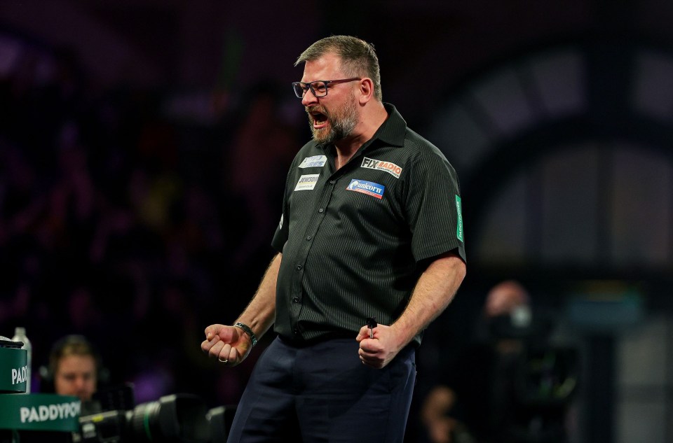 James Wade celebrating a win at the 2024 PDC World Darts Championship.