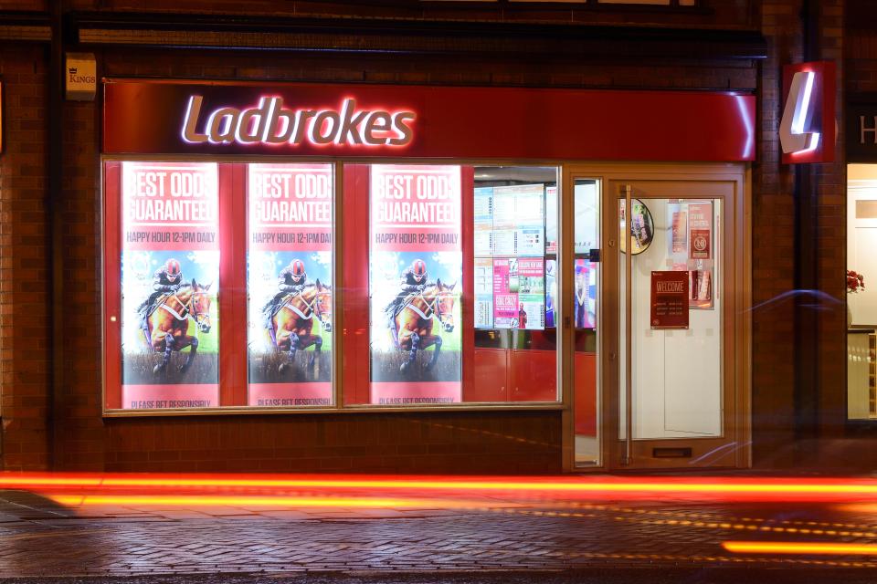 Ladbrokes betting shop at night.