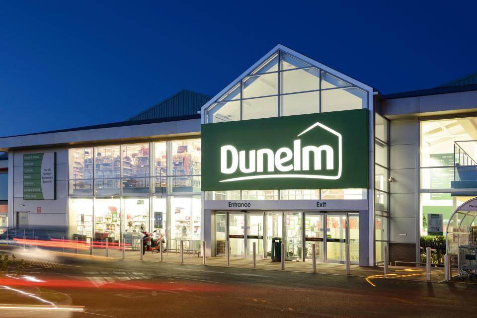 Dunelm store entrance at night.