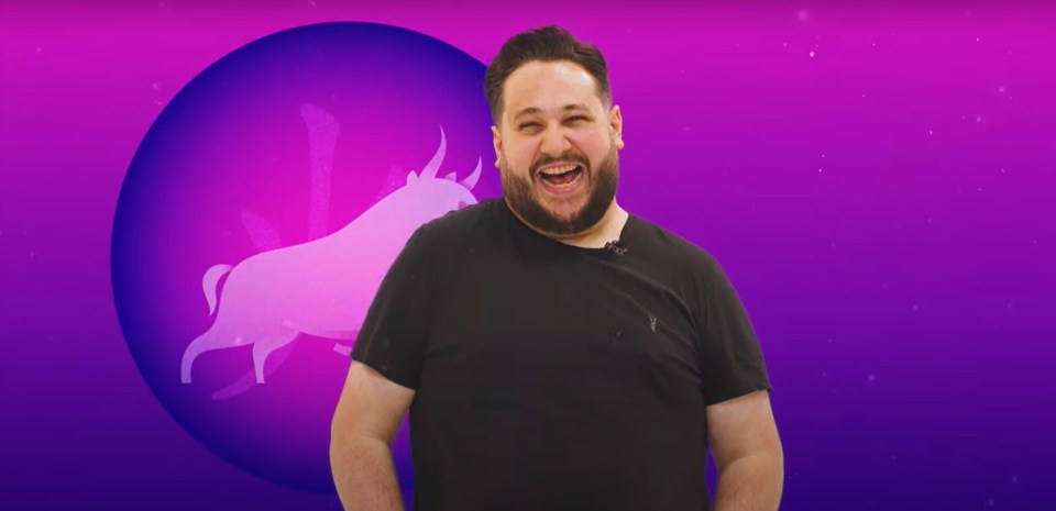 Screenshot of a man smiling in front of a Taurus zodiac sign.