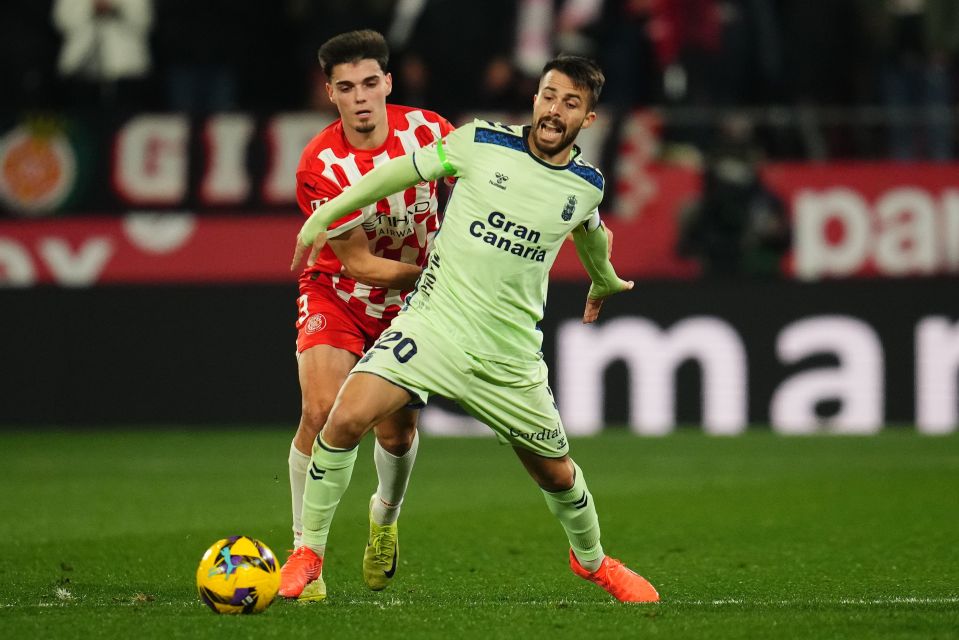 Soccer players vying for the ball during a match.