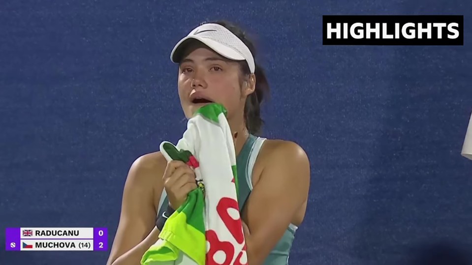 Emma Raducanu crying during a tennis match.