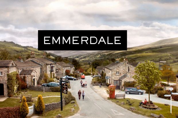 Emmerdale logo with village setting.