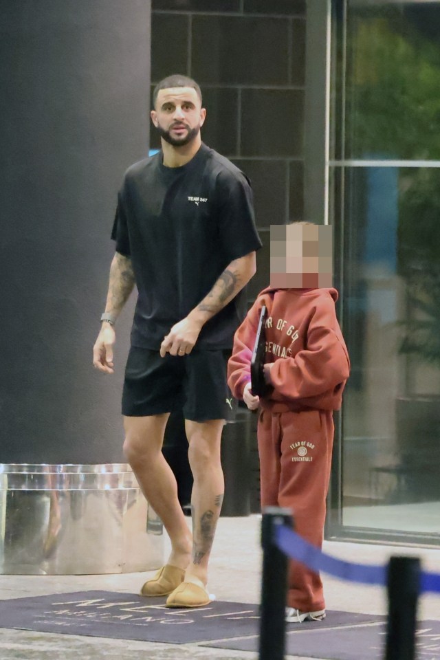 Kyle Walker with his child at a hotel in Milan.