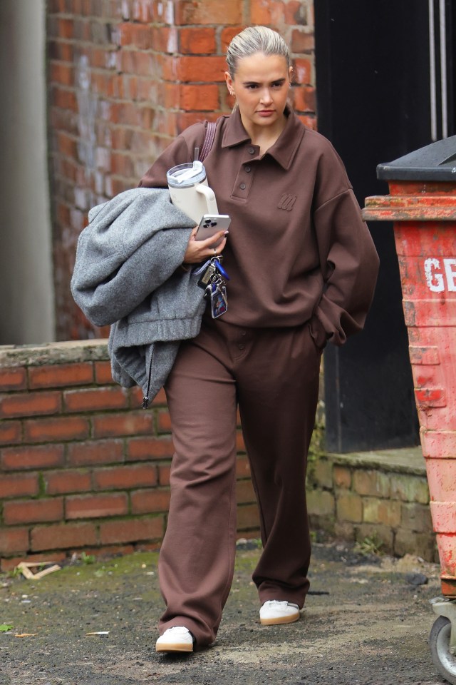 Molly-Mae Hague leaving her office in a brown tracksuit.