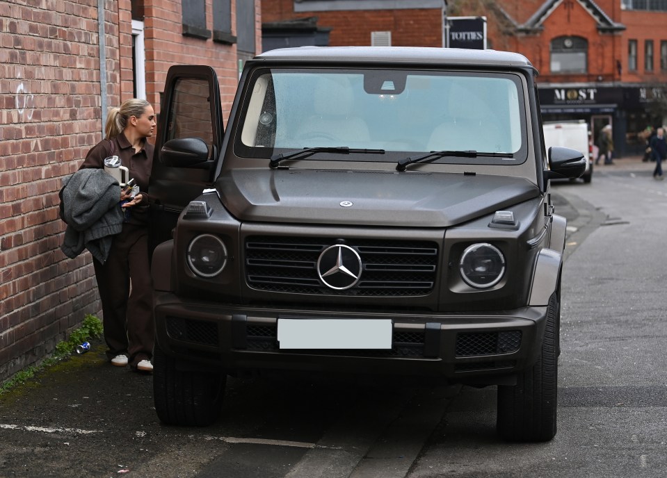 Molly Mae Hague leaving her office, getting into her Mercedes G-Wagon.