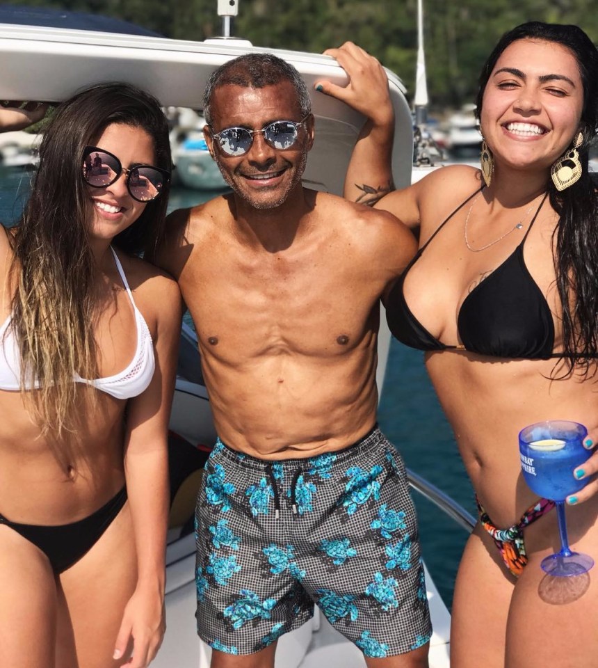 Romario's daughters and him on a boat.