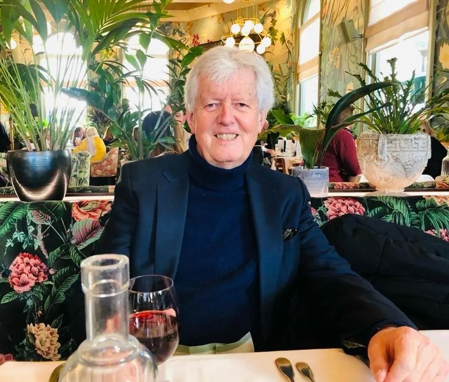 Photo of Garth Pearce, a Sun writer and legendary film critic, sitting at a restaurant table.