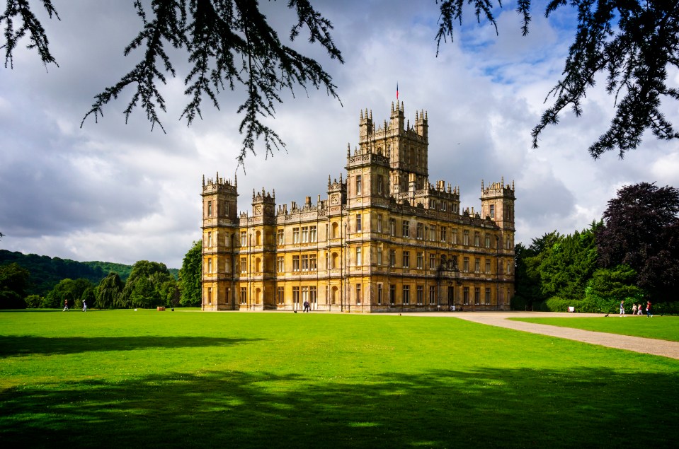 Hampshire, England, UK - 4th August, 2012: Highclere Castle is an English country residence circa 1600 which has become known to millions around the world as Downton Abbey from the TV series of the same name. Now a major tourist attraction around 1,200 people per day visit this iconic location to enjoy the splendour of the house and walk in the footsteps of the much actors much loved by their fans.