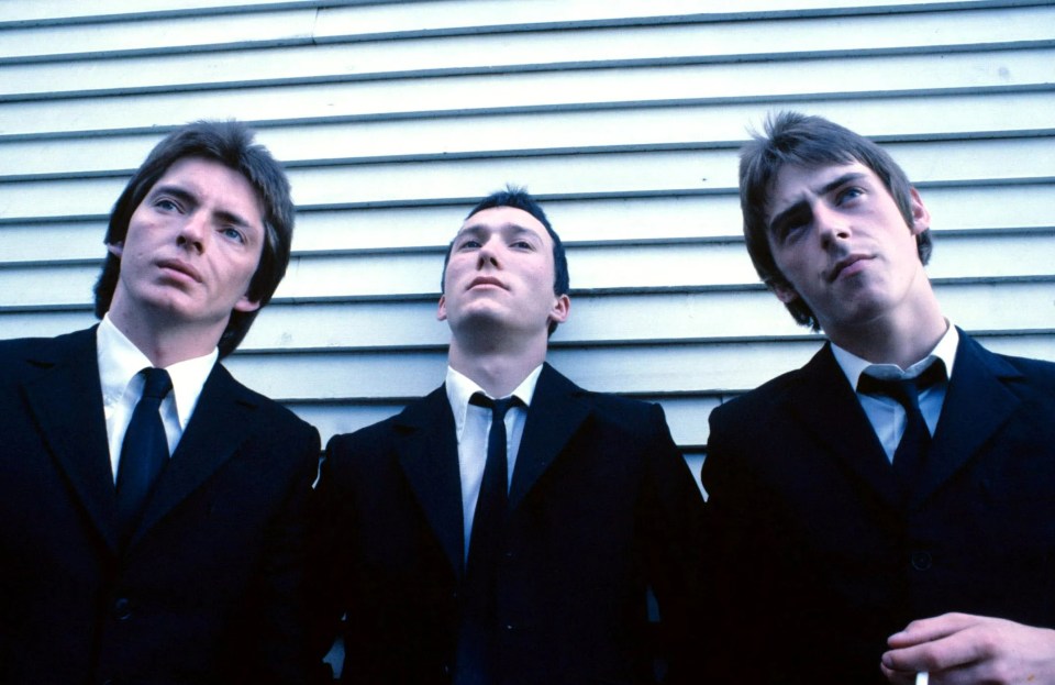 Photo of The Jam band members Bruce Foxton, Rick Buckler, and Paul Weller.