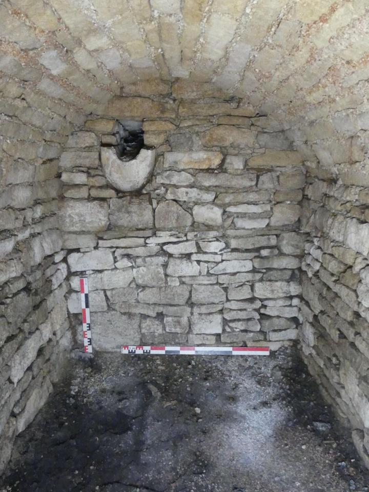 Stone wall structure with a stone basin.