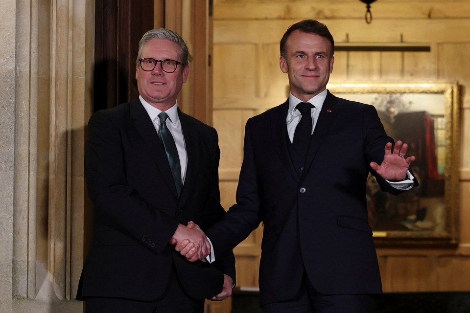 Keir Starmer and Emmanuel Macron shaking hands.