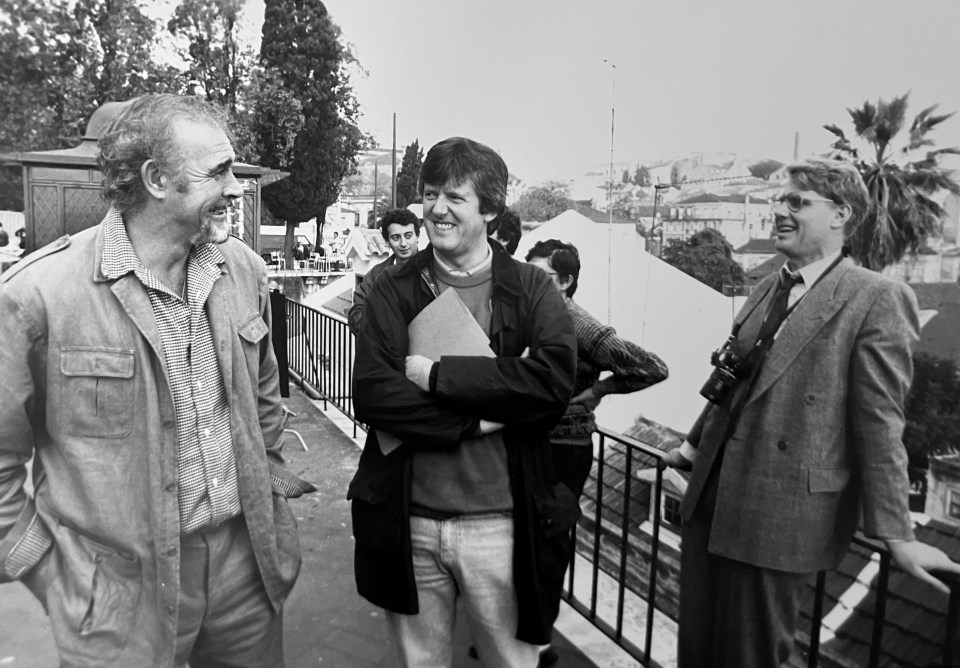 Black and white photo of Garth Pearce with colleagues.