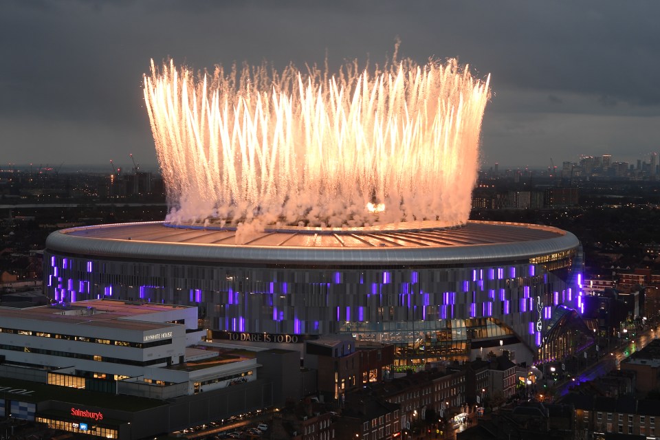 Fireworks exploding over Tottenham Hotspur Stadium.