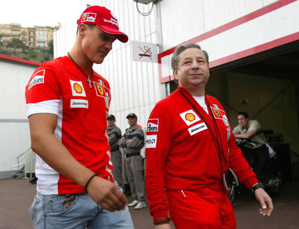 Michael Schumacher and Jean Todt walking in the pits at the Monaco Grand Prix.