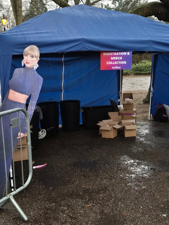 A registration and merch collection tent at a disaster-stricken Fyre Festival 5k fun run.