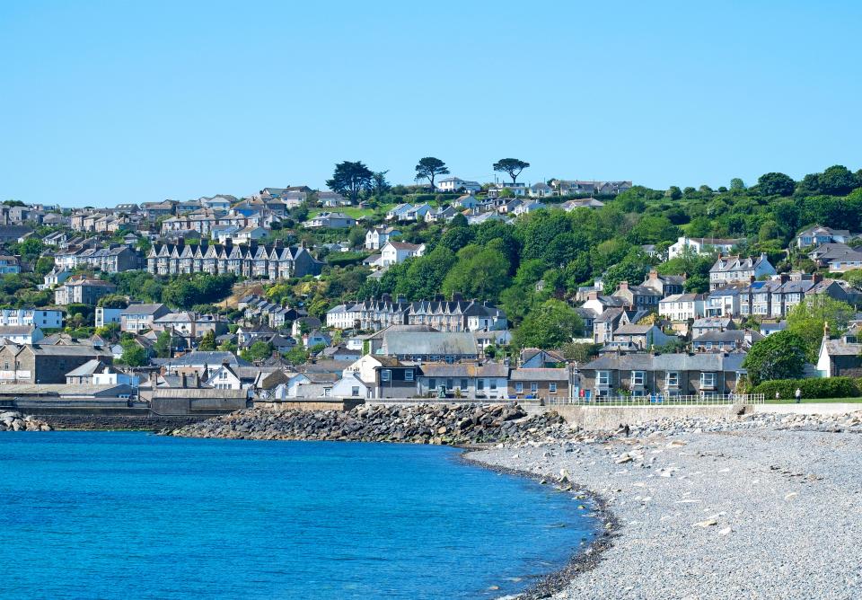 Coastal town of Penzance, Cornwall, UK, seen from the beach.