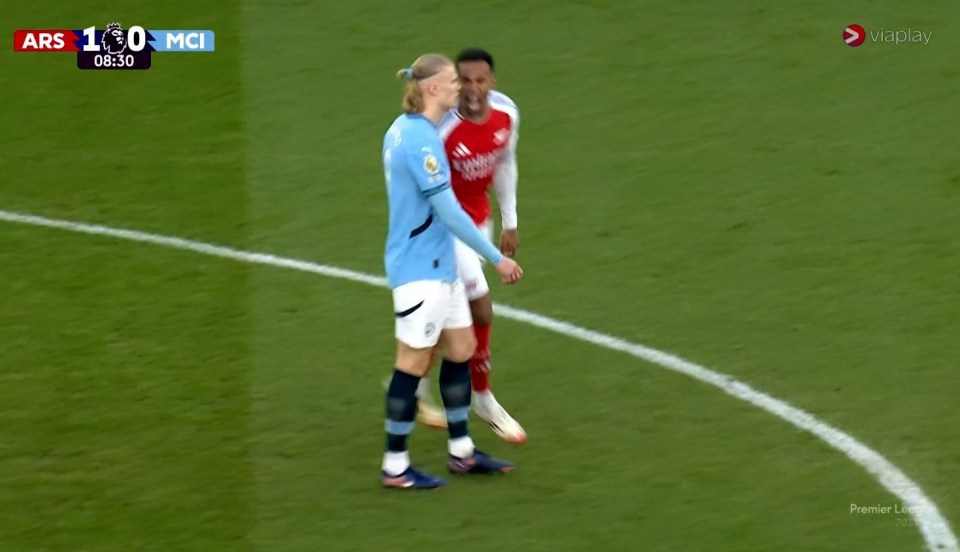 Gabriel celebrating in Haaland's face during an Arsenal vs Manchester City game.