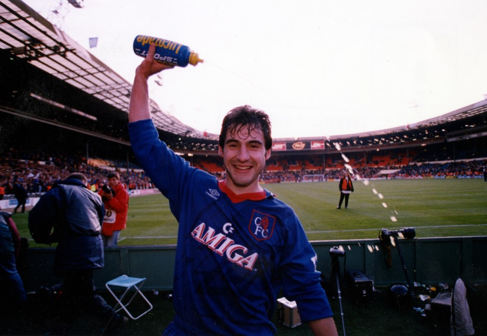 Gavin Peacock celebrates Chelsea's victory, raising a sports drink bottle.