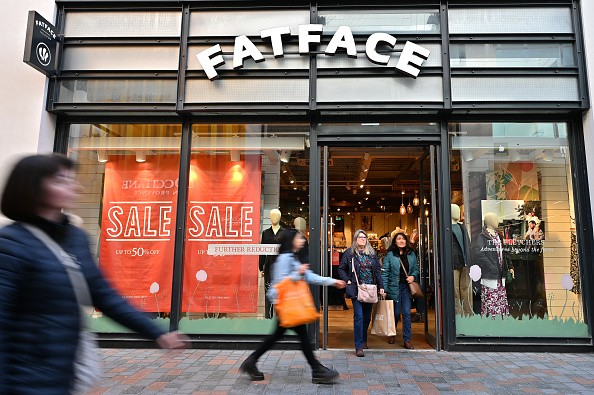 Exterior view of a FatFace clothing store with a sale sign in the window.