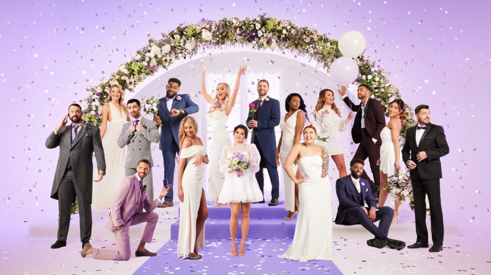 Group photo of sixteen people in wedding attire.