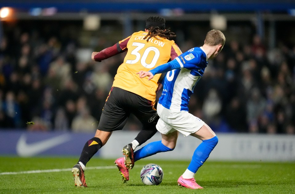 Birmingham City's Jay Stansfield gets fouled by Bradford City's Romoney Crichlow during a soccer match.