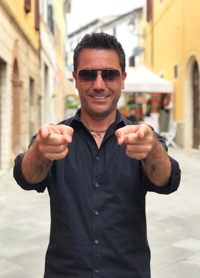 Gino D'Acampo pointing at the viewer.