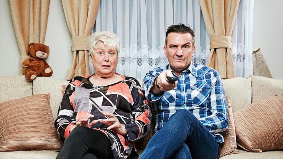 Jenny and Lee from Gogglebox watching television.