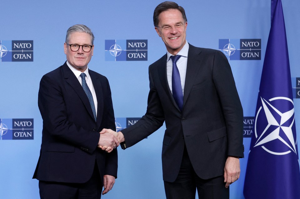 NATO Secretary General Mark Rutte shaking hands with UK Prime Minister Keir Starmer.