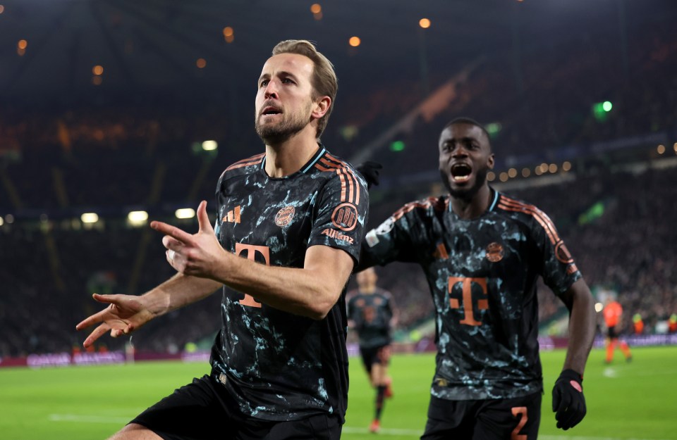 Harry Kane of Bayern Munich celebrates a goal with a teammate.