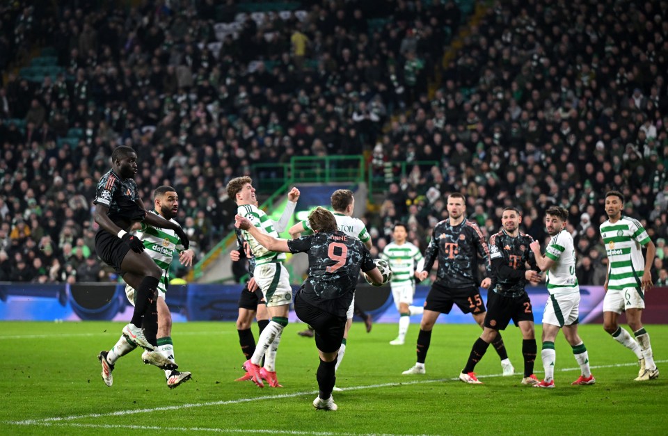 Harry Kane scoring a goal during a soccer match.