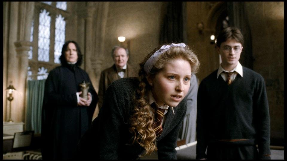 Scene from Harry Potter and the Half-Blood Prince showing Harry, Ginny, Snape, and Slughorn.