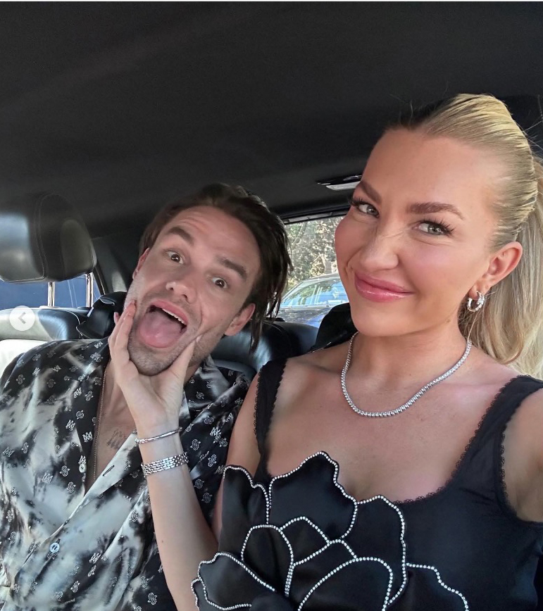 Photo of a man and woman in a car; the man is making a funny face.