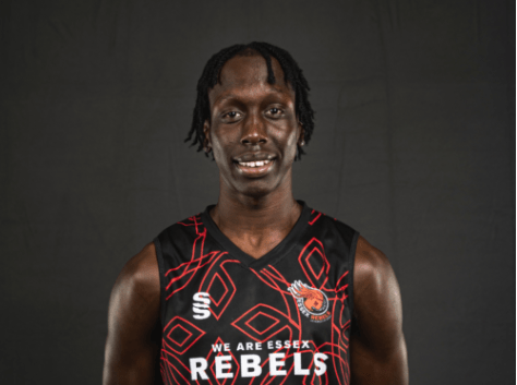 Portrait of a smiling man in an Essex Rebels jersey.