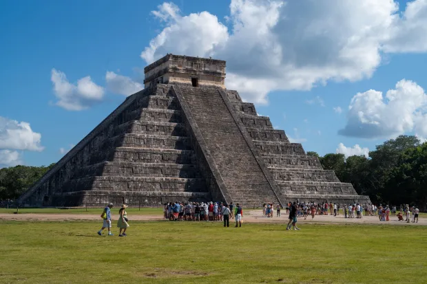 Tourists at the Kukulkan Pyramid in Chichen Itza.